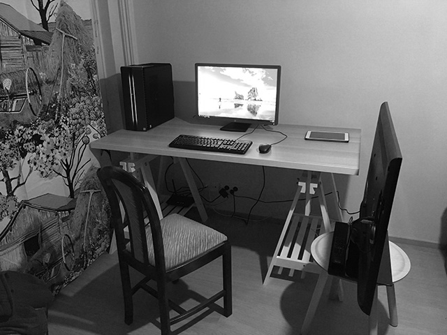 Small office desk and table in a corner